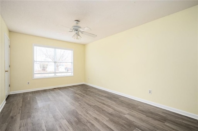 4157 Lake Mist Dr NW, Kennesaw, GA 30144 - unfurnished room with a ceiling fan, baseboards, and dark wood-style floors