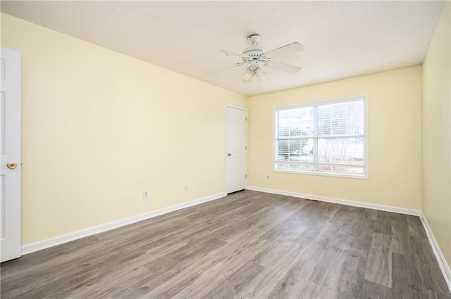 4157 Lake Mist Dr NW, Kennesaw, GA 30144 - empty room featuring a ceiling fan, baseboards, and wood finished floors