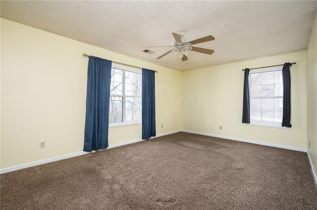 4157 Lake Mist Dr NW, Kennesaw, GA 30144 - carpeted spare room featuring baseboards, a ceiling fan, a textured ceiling, and visible vents