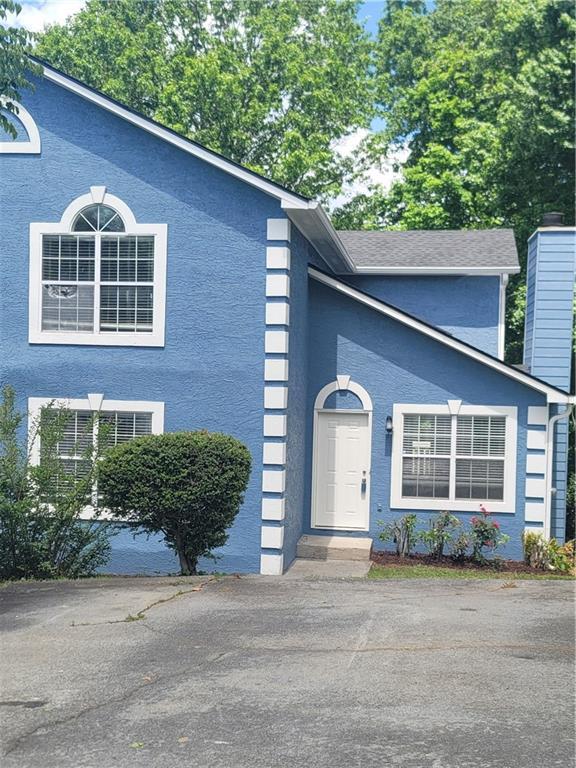 4157 Lake Mist Dr NW, Kennesaw, GA 30144 - tri-level home featuring a chimney