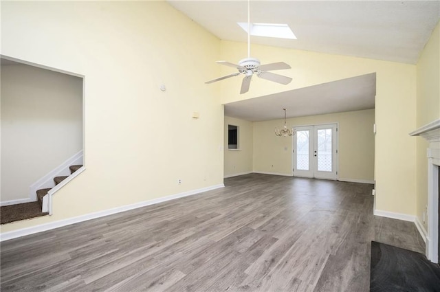 4157 Lake Mist Dr NW, Kennesaw, GA 30144 - unfurnished living room featuring ceiling fan, a fireplace, high vaulted ceiling, french doors, and wood finished floors