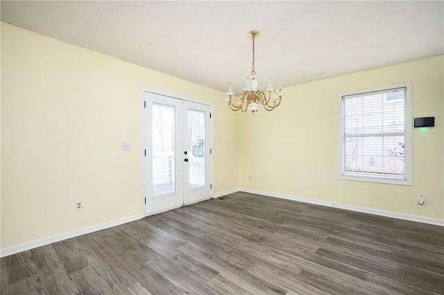 4157 Lake Mist Dr NW, Kennesaw, GA 30144 - spare room featuring baseboards, french doors, a chandelier, and dark wood finished floors