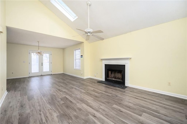 4157 Lake Mist Dr NW, Kennesaw, GA 30144 - unfurnished living room featuring a fireplace, high vaulted ceiling, ceiling fan with notable chandelier, baseboards, and wood finished floors