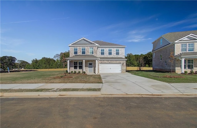 view of front of home with a garage and a front lawn