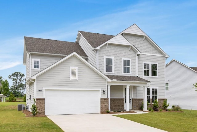 39 Pecan Ct, Hoschton, GA 30548 - craftsman-style home with a front yard, driveway, an attached garage, and roof with shingles