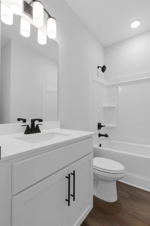 39 Pecan Ct, Hoschton, GA 30548 - bathroom featuring vanity and wood-type flooring