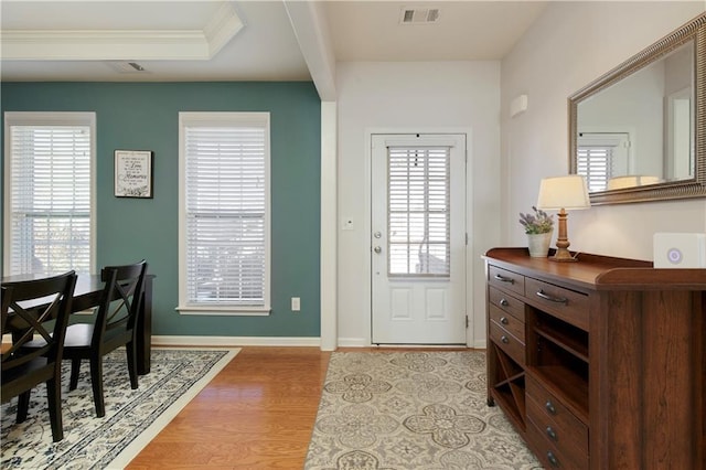 foyer with light hardwood / wood-style floors