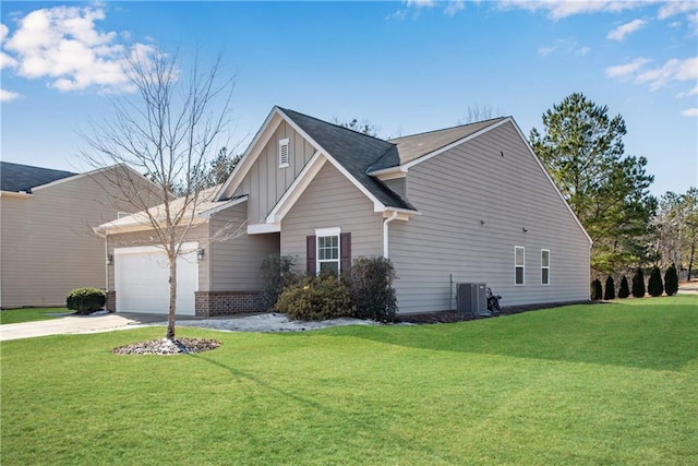 view of front facade with central AC, a front yard, and a garage