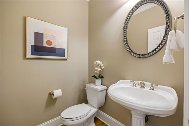 bathroom featuring sink and toilet