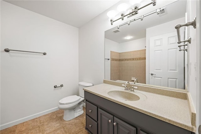 bathroom with tile patterned floors, vanity, and toilet