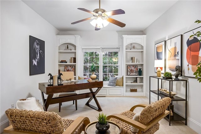 home office featuring light colored carpet and ceiling fan