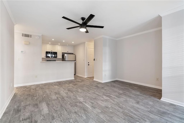 unfurnished living room with a ceiling fan, visible vents, crown molding, and light wood-style flooring