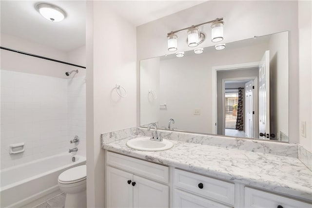 bathroom with shower / bathing tub combination, vanity, and toilet