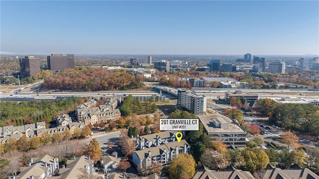 birds eye view of property featuring a city view