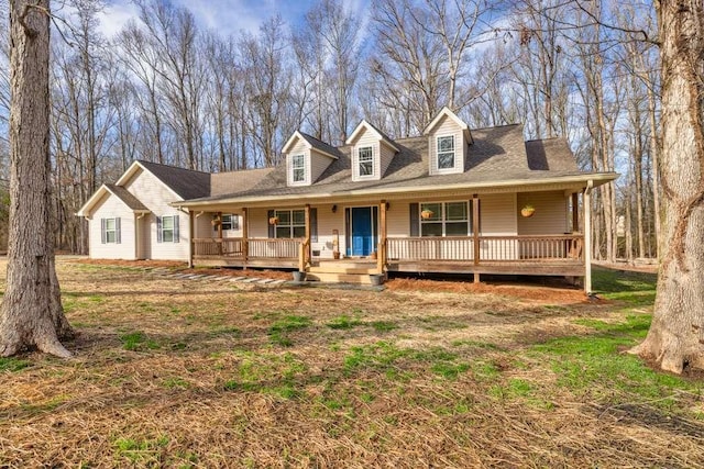 new england style home featuring covered porch