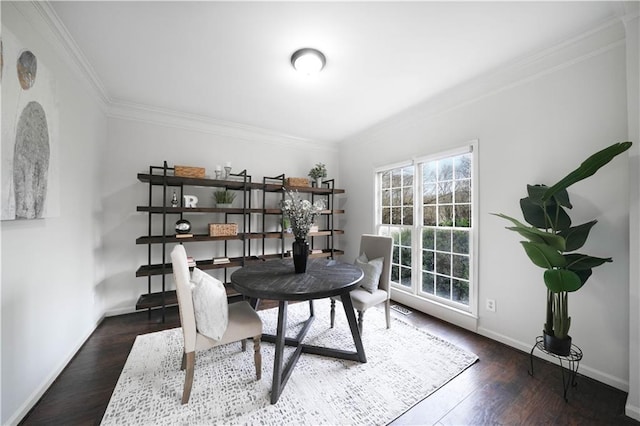 office area with dark wood-style floors, ornamental molding, and baseboards