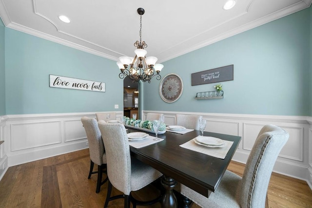 7251 Bluewater Ln, Douglasville, GA 30135 - dining area with ornamental molding, a chandelier, wainscoting, wood finished floors, and recessed lighting