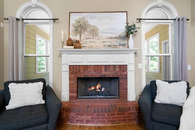 7251 Bluewater Ln, Douglasville, GA 30135 - living room with a brick fireplace and wood finished floors