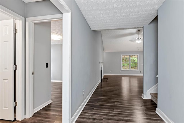 285 Kentshire Pl, Lawrenceville, GA 30044 - corridor featuring dark wood-style flooring, baseboards, stairs, and lofted ceiling