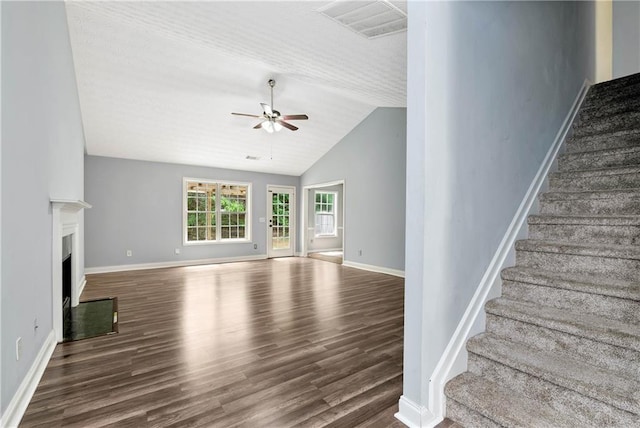 285 Kentshire Pl, Lawrenceville, GA 30044 - unfurnished living room featuring a ceiling fan, wood finished floors, lofted ceiling, stairway, and baseboards