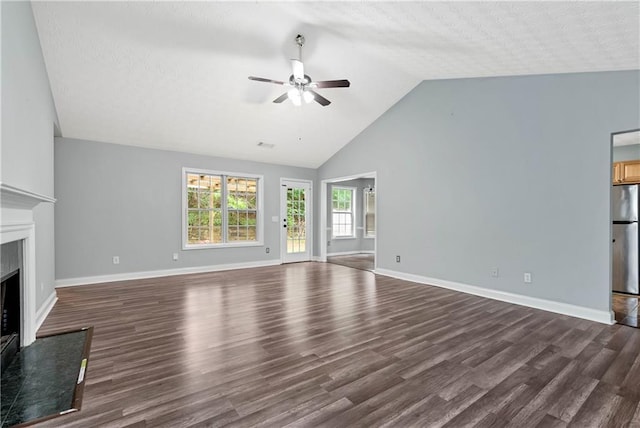 285 Kentshire Pl, Lawrenceville, GA 30044 - unfurnished living room featuring ceiling fan, dark wood finished floors, a fireplace, baseboards, and high vaulted ceiling