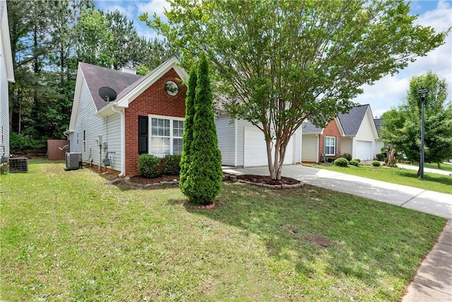 285 Kentshire Pl, Lawrenceville, GA 30044 - view of front of property featuring concrete driveway, brick siding, cooling unit, a front lawn, and a garage