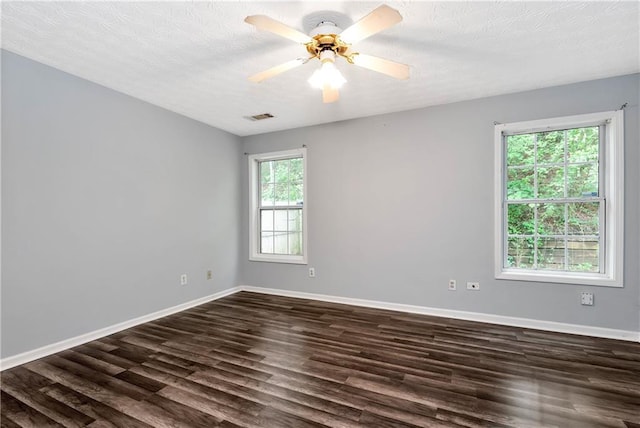 285 Kentshire Pl, Lawrenceville, GA 30044 - spare room featuring dark wood finished floors, baseboards, a textured ceiling, and a ceiling fan