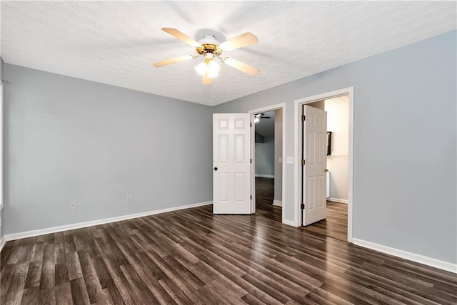 285 Kentshire Pl, Lawrenceville, GA 30044 - unfurnished bedroom featuring wood finished floors, baseboards, a textured ceiling, and ceiling fan