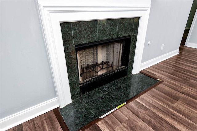 285 Kentshire Pl, Lawrenceville, GA 30044 - detailed view of a high end fireplace, baseboards, and wood finished floors