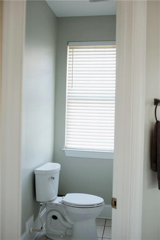 bathroom with tile patterned floors and toilet