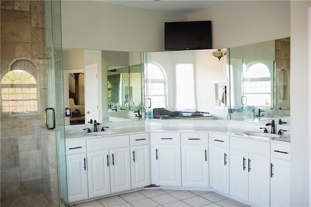 bathroom featuring vanity, tile patterned floors, and an enclosed shower