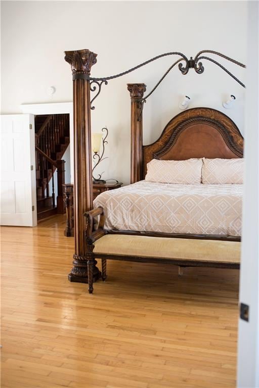 bedroom with hardwood / wood-style flooring