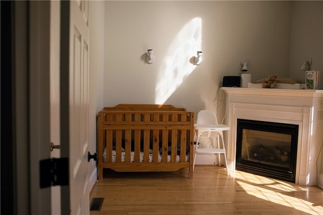 bedroom with light hardwood / wood-style floors