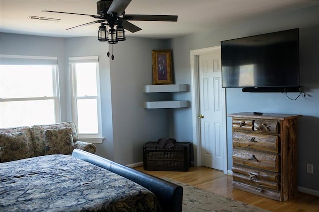 bedroom featuring ceiling fan and light hardwood / wood-style flooring