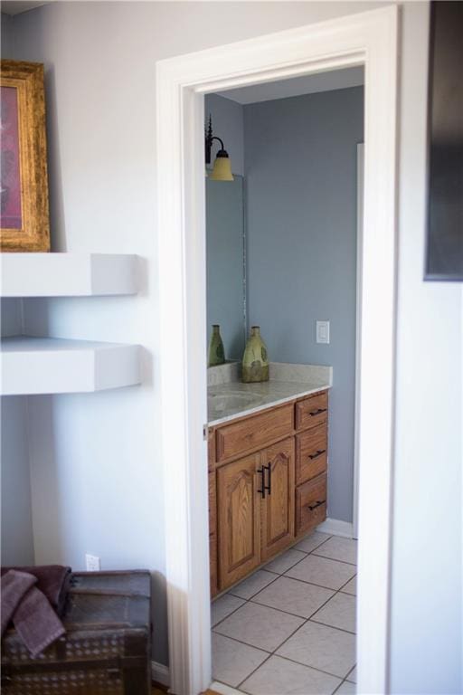 bathroom with tile patterned floors and vanity