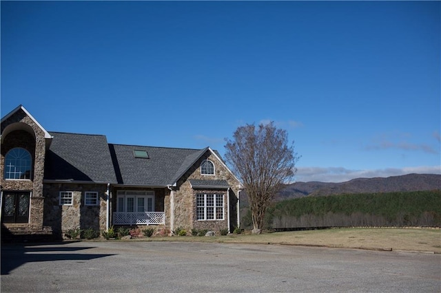 view of front of home featuring a mountain view