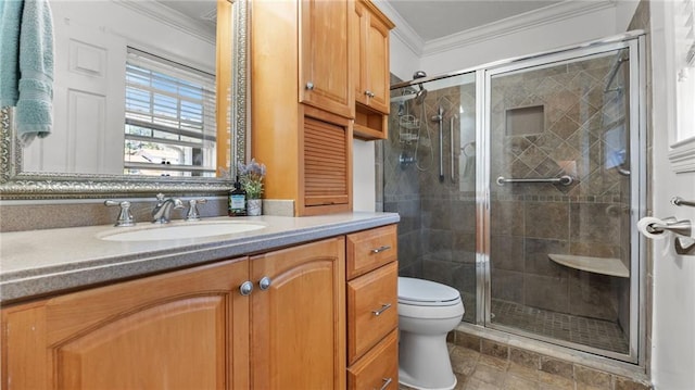 bathroom with a stall shower, toilet, ornamental molding, and vanity