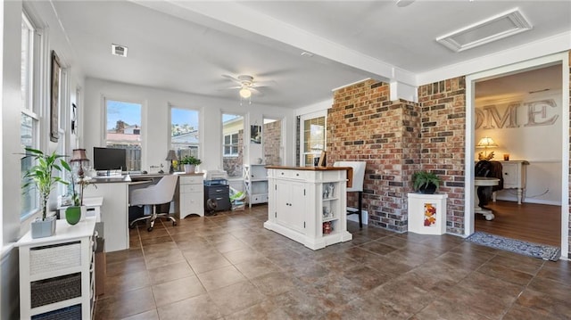 home office with beamed ceiling, a ceiling fan, and visible vents