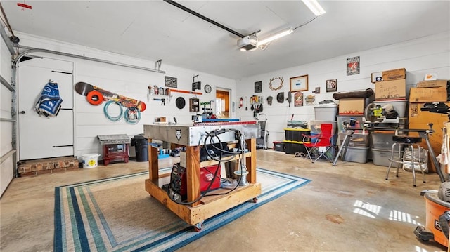 garage featuring a workshop area and a garage door opener