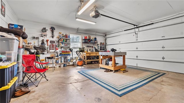 garage featuring a workshop area and a garage door opener