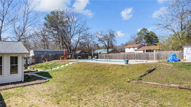 view of yard featuring a fenced in pool and a fenced backyard