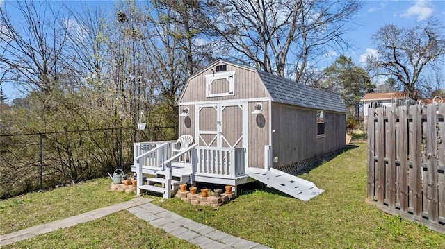 view of shed with fence