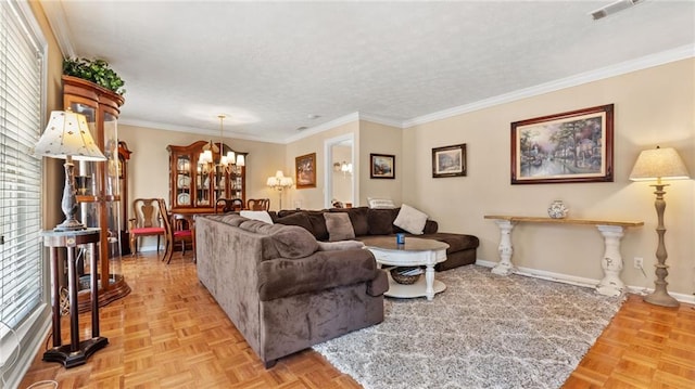 living area featuring visible vents, baseboards, ornamental molding, a textured ceiling, and a notable chandelier