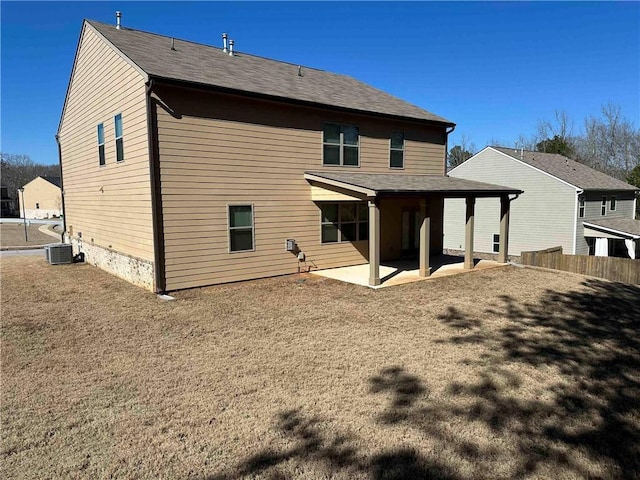 rear view of property with central AC and a patio area