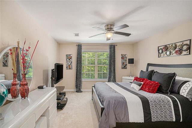 bedroom featuring a ceiling fan, carpet flooring, visible vents, and baseboards