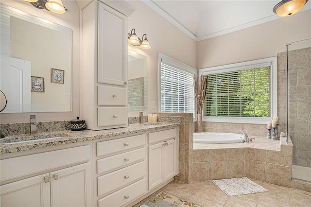full bathroom featuring double vanity, crown molding, a garden tub, and a healthy amount of sunlight