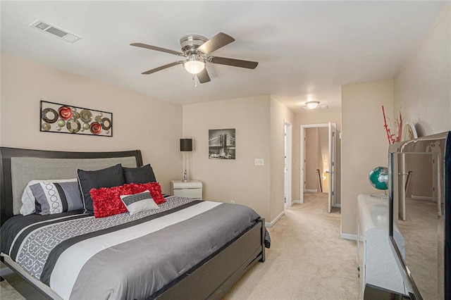 bedroom with light colored carpet, baseboards, ceiling fan, and visible vents