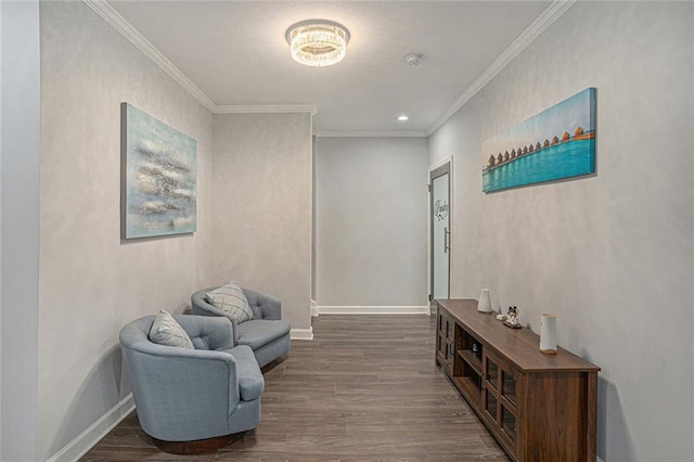 corridor with ornamental molding, baseboards, and wood finished floors