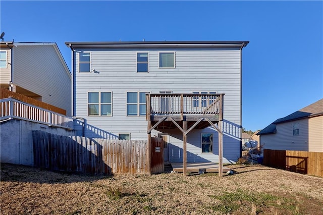 back of property with a wooden deck