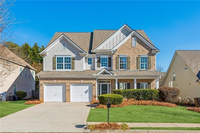 view of front of house with central AC, a garage, and a front lawn